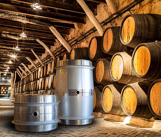 Steel Wine Barrels Contrasted Against Wood Wine Barrel